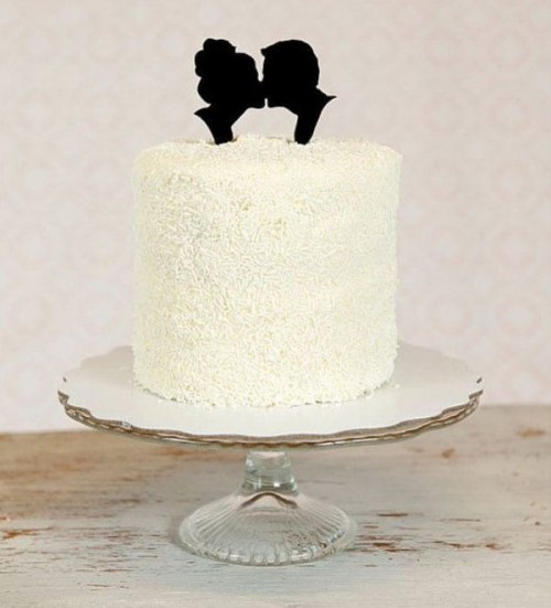 a textural white wedding cake with black head silhouettes is a classic idea that can be great for a vintage wedding