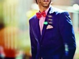 a bold blue suit, a pink shirt, a red bow tie and a printed handkerchief for a fun groom’s look