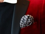 a bright red velvet tuxedo with black lapels, a white shirt and a black jumper to show off the unique style