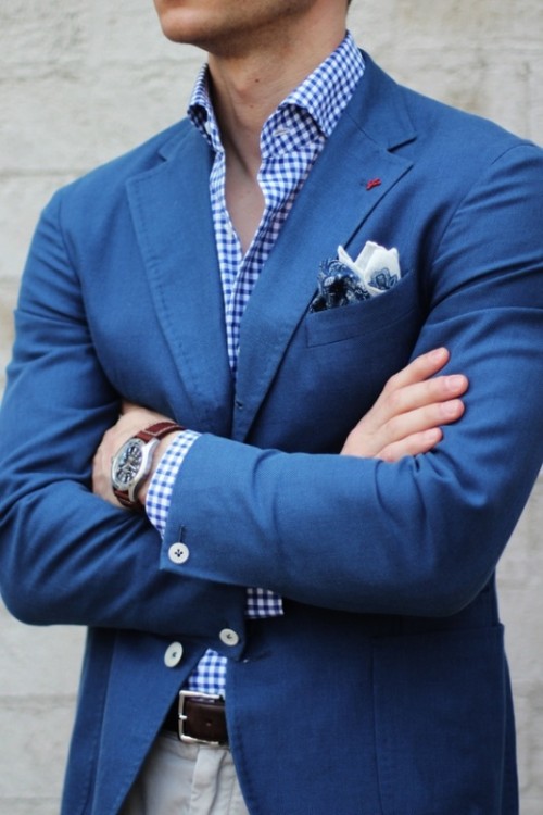 a bold blue jacket, a plaid shirt and printed handkerchiefs for a stylish and relaxed summer groom's look
