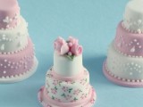 a floral and pink mini wedding cake topped with pink sugar blooms for a very chic vintage wedding