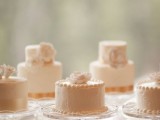 white textural buttercream individual wedding cakes topped with white sugar blooms for a vintage wedding