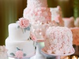 mini cakes – a plain white one with pink sugar blooms and two cakes completely covered with blush and white flowers
