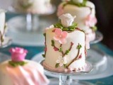 tiny individual wedding cakes decorated with blooming branches of sugar will fit for a spring wedding perfectly