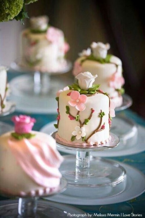 tiny individual wedding cakes decorated with blooming branches of sugar will fit for a spring wedding perfectly