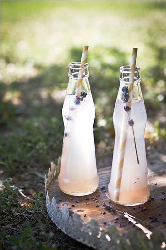 Fresh lavender lemonade in mini bottles and straws will refresh your guests perfectly at a spring or summer wedding