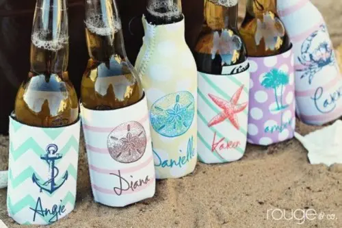 dress up beer bottles into beach covers to match your beach or coastal wedding theme and style