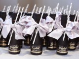 mini champagne bottles with pretty bows are perfect wedding favors for any modern wedding