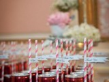 Coke cans with small paper straws and tags can be escort cards and refreshing wedding favors at the same time