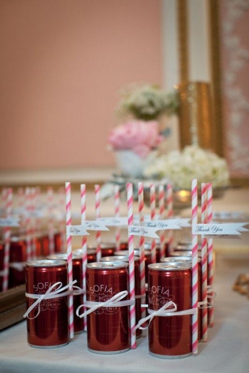 Coke cans with small paper straws and tags can be escort cards and refreshing wedding favors at the same time