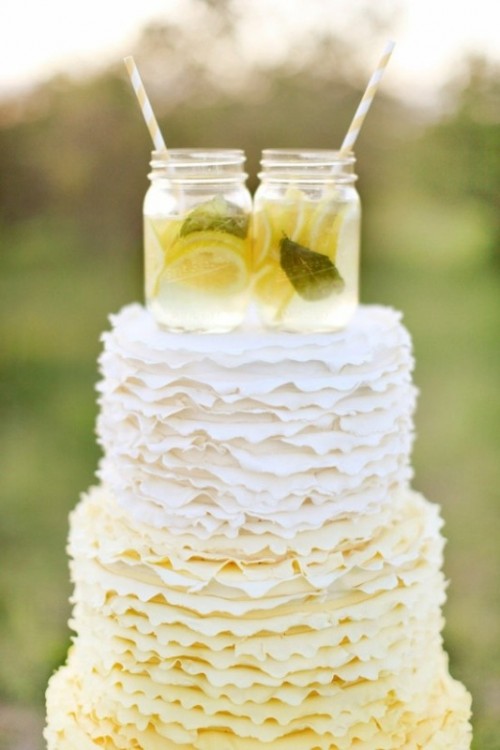 an ombre white to yellow ruffle wedding cake topped with mason jars with lemonade and straws is a very cool and lovely idea