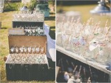 mason jars with tags and straws are great to serve drinks at a wedding, they can be placed on stands or in large chests to keep the atmosphere up