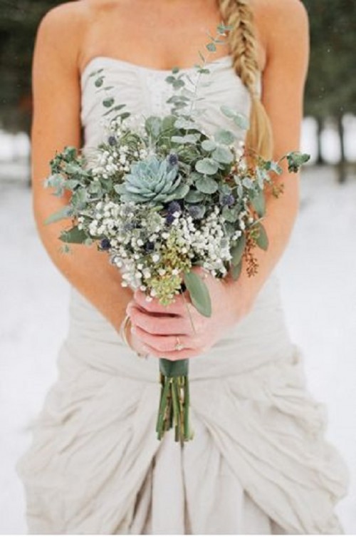 a greenery wedding bouquet with succulents, eucalyptus, thistles and baby's breath looks really unusual and cool
