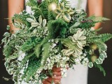 a textural greenery wedding bouquet with various types of greenery and various shades of green, with soem ferns and lotus