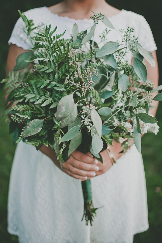 A textural greenery wedding bouquet with blooming branches is a cool idea for a casual spring or summer wedding