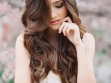 wavy locks down are the most timeless and lovely hairstyle ever, and you may wear it with literally any bridal look and style