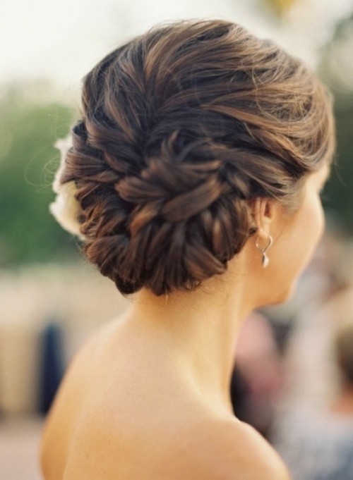 a beautiful and very tight low updo with twists and some blooms on one side will make you pciture-perfect all day long, whatever the weather is