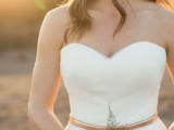 a refined sweetheart neckline fitting wedding dress with a copper belt are a great and chic combo for a modern wedding