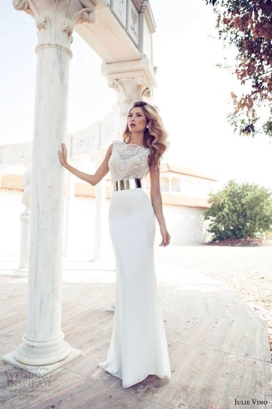 a sophisticated modern wedding dress with a sleeveless lace bodice with a high neckline and a plain skirt plus a statement polished metal belt that wows