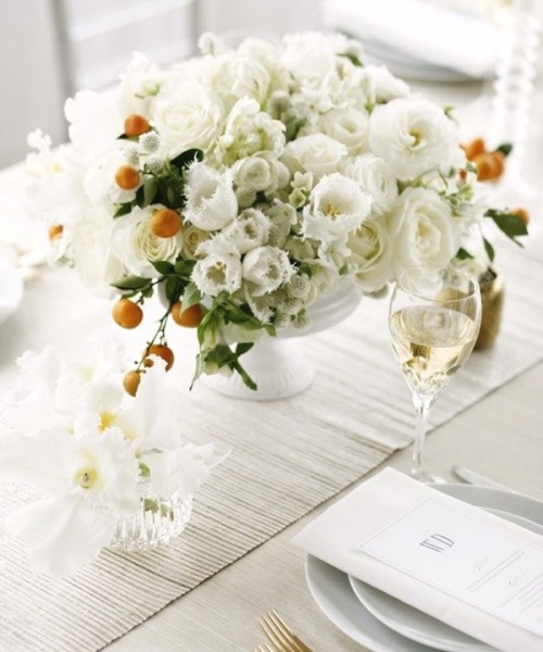 a beautiful summer wedding centerpiece of white blooms and kumquat branches is a lovely idea that is easy to recreate