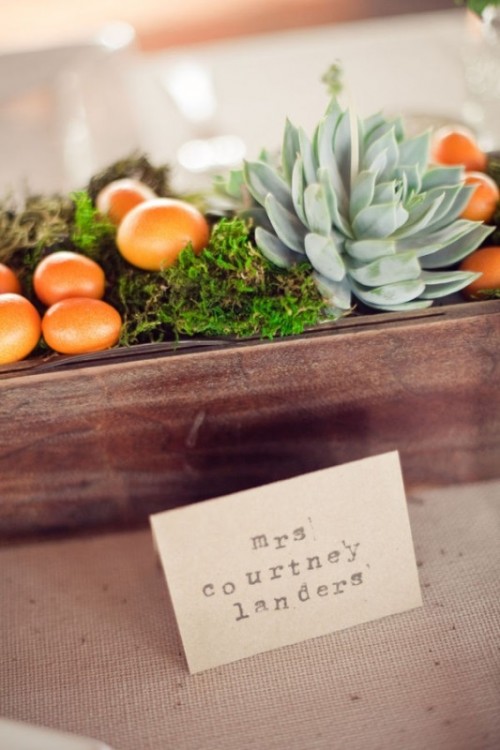 a stained box with moss, succulents, greenery, kumquats and a card is a lovely idea for a rustic summer wedding or a rustic tropical one