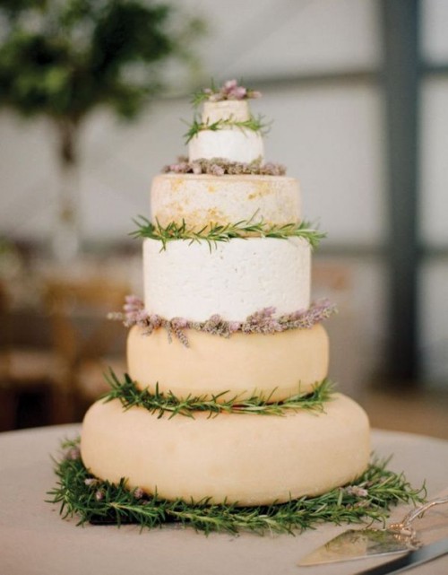 a lovely cheese wheel wedding cake decorated with lavender and thyme is a chic idea for a Provence-inspired wedding