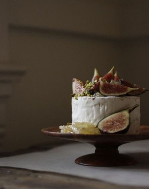 a cheese wheel wedding cake topped with delicious fresh figs is a gorgeous idea for a fall wedding