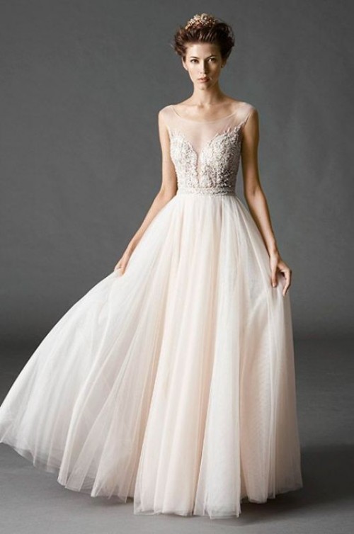 a beautiful refined wedding dress with an embellished and illusion bodice, a layered blush skirt is a lovely idea for a formal wedding
