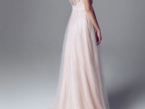 a beautiful blush wedding dress with a white lace bodice, a cutout back and a blush layered skirt is a tender and elegant option
