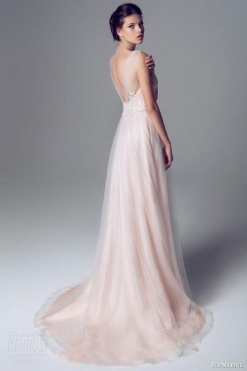 a beautiful blush wedding dress with a white lace bodice, a cutout back and a blush layered skirt is a tender and elegant option