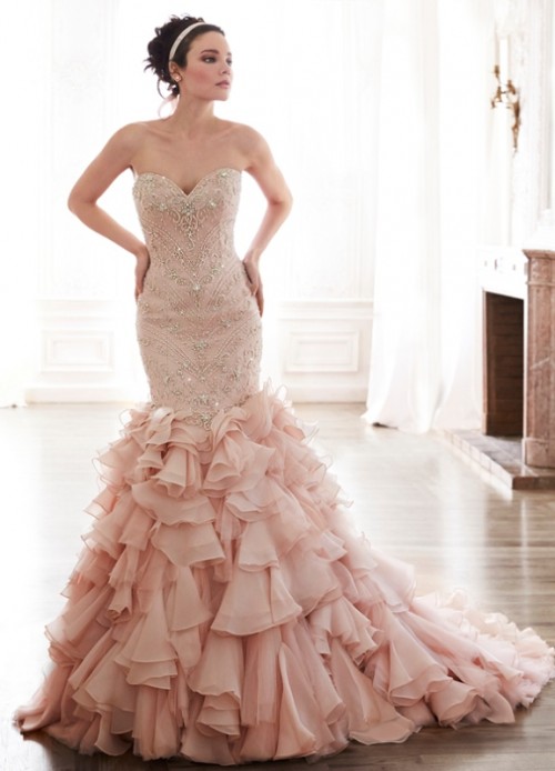 a blush mermaid wedding dress of lace, with rhinestones and a ruffled skirt with a train is a very tender and girlish idea