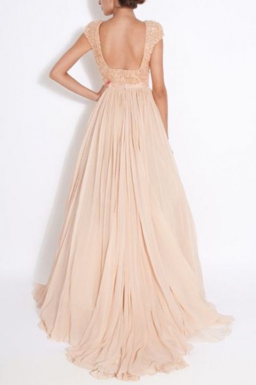 a blush A-line wedding dress with an embellished bodice, short sleeves, a cutout back and a pleated skirt with a train