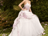 a strapless A-line wedding dress with a floral bodice and a skirt is refined, romantic and vintage-inspired