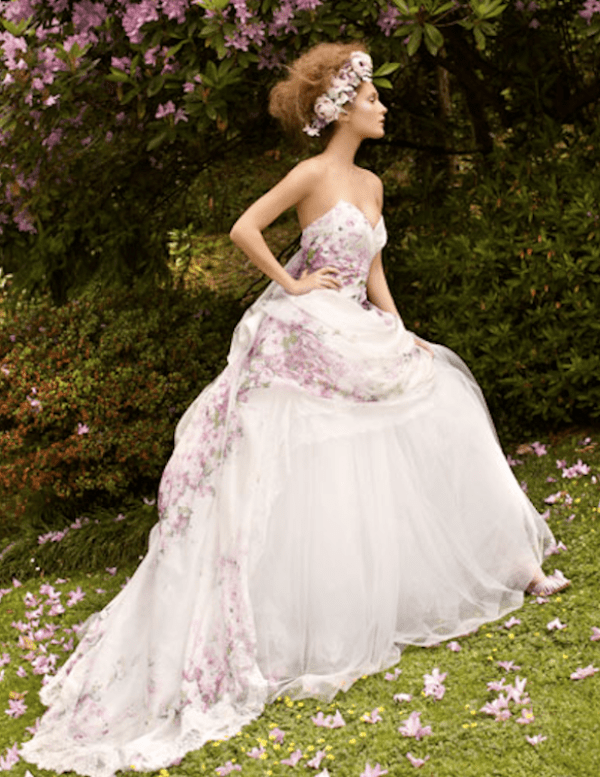 A strapless A line wedding dress with a floral bodice and a skirt is refined, romantic and vintage inspired