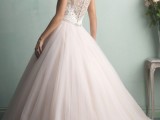 a refined wedding dress of a lace bodice, a beautiful lace back and a pleated blush skirt with a train is very romantic