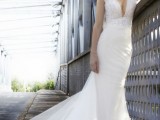 a mermaid wedding dress with no sleeves, a plunging neckline, a lace bodice and a plain skirt with a train
