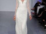 a lace off the shoulder wedding dress with a plunging neckline and long sleeves plus a train