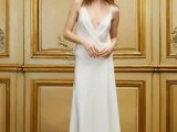 a minimalist plain spaghetti strap wedding dress with a plunging neckline and a draped bodice