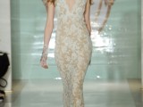 a nude sheath wedding dress with no sleeves, white lace and a plunging neckline
