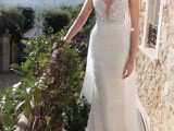 a super sexy and bold sheath spaghetti strap wedding dress with a plunging neckline just wows