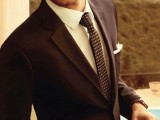 a deep purple pantsuit, a white shirt, a matching printed skinny tie are a great outfit for a fall or winter wedding