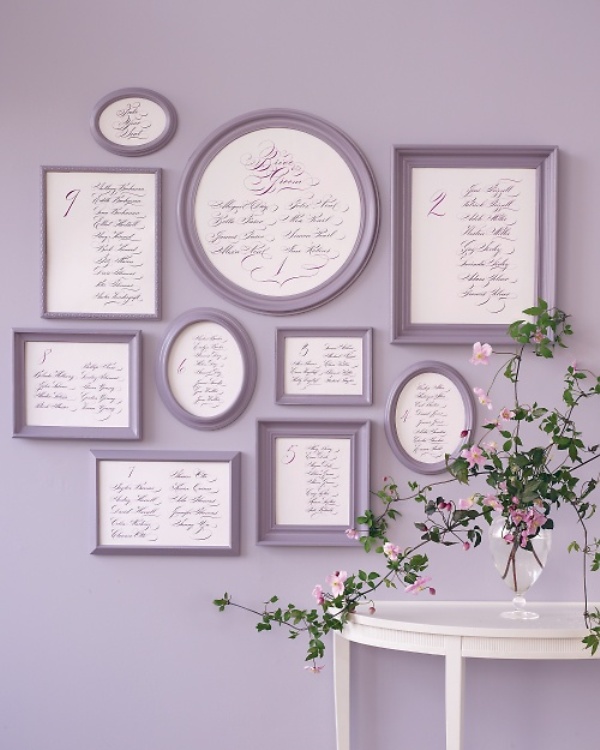 A stylish wall mounted vintage seating chart of grey frames is a very elegant idea, it won't take space and can be DIYed