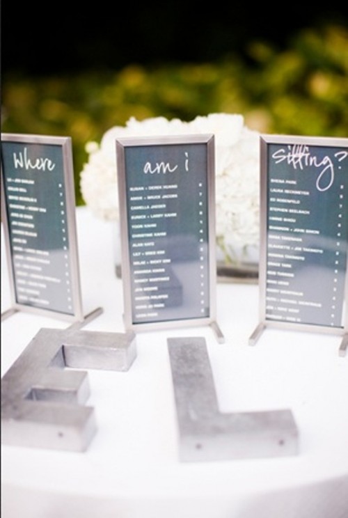a modern seating chart of various pieces in simple frames is a stylish and very simple idea for a modern wedding
