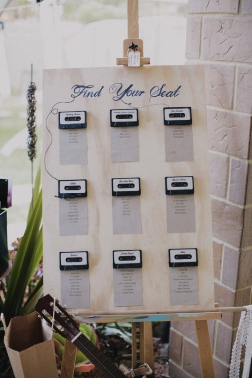 a retro wedding seating chart with cassettes is a cool idea for a nostalgic wedding
