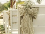 white chairs with burlap and lace decor and with baby’s breath are amazing for a rustic space, they will add elegance to it