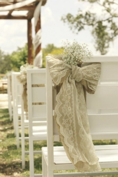 white chairs with burlap and lace decor and with baby's breath are amazing for a rustic space, they will add elegance to it