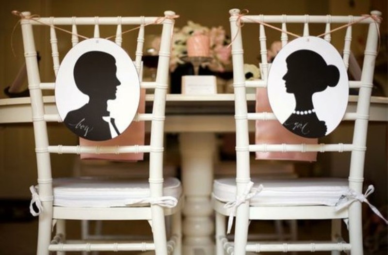 Chairs with elegant silhouette decor on them are a stylish idea for a wedding, they will add a slight vintage feel to your reception