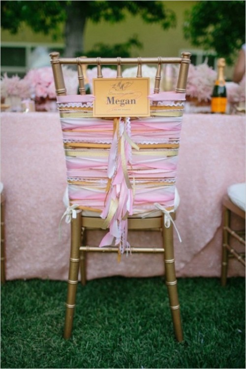 a gold chair with pink, orange, yellow and white ribbons and fringe is a fantastic idea for a wedding, add a name on the chair to mark where and who is sitting