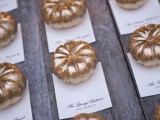 beautiful mini gilded pumpkins with cards are lovely wedding escort cards and favors for a fall wedding