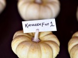 natural pumpkins with cards are creative and easy escort cards for a fall wedding